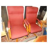 2 padded arm chairs on wheels