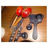 Hand held musical instruments