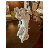 Porcelain cherub statue