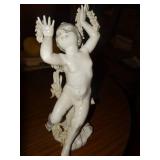Porcelain cherub statue