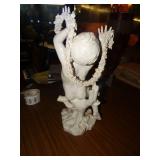 Porcelain cherub statue