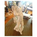 Porcelain cherub statue