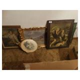 Several pieces of framed artwork