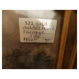 Several pieces of framed artwork