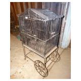 Metal bird cage on cart