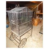 Metal bird cage on cart