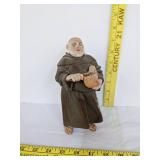 Algora porcelain religious monk slicing a loaf of bread statue
