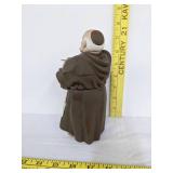 Algora porcelain religious monk slicing a loaf of bread statue