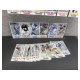Approximately 40 Gameday NFL Oversized Football Cards