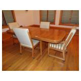 TABLE W/4 LEATHER CHAIRS ON WHEELS