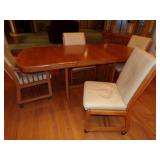 TABLE W/4 LEATHER CHAIRS ON WHEELS