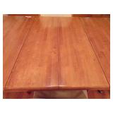 TABLE W/4 LEATHER CHAIRS ON WHEELS