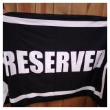 BEACH TOWEL BLACK WITH RESERVED ON IT