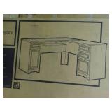 realspace Magellan L-shaped desk, gray in color. New in box. Measurements in pictures.