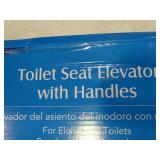 Toilet seat elevator with handles.