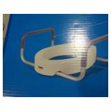 Toilet seat elevator with handles.