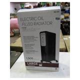 Electric oil filled 1500 watt radiator heater, new in box.