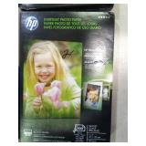 5 boxes of different brands of photo paper.