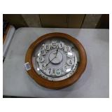 Small World Rhythm wall clock. Has 3 different selections of melodies.