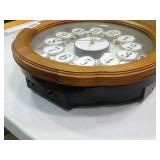 Small World Rhythm wall clock. Has 3 different selections of melodies.