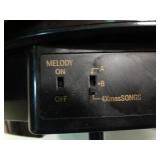 Small World Rhythm wall clock. Has 3 different selections of melodies.