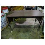 Small desk with built in outlets.