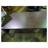 Small desk with built in outlets.