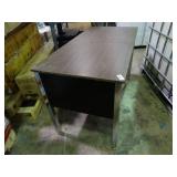 Small desk with built in outlets.