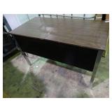 Small desk with built in outlets.