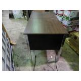 Small desk with built in outlets.