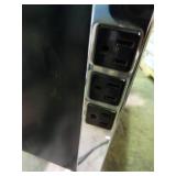 Small desk with built in outlets.