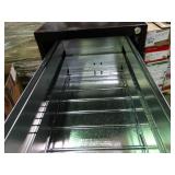 New 4 drawer file cabinet with lock and key.