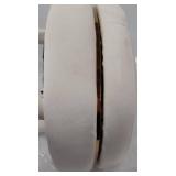 gold and cream colored stool that swivels