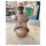 Cast iron coin bank, boy sitting on pot