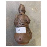 Cast iron coin bank, boy sitting on pot