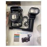 Canon 35mm camera with flash and manual