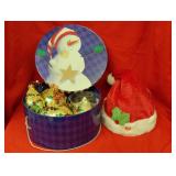 Snowman tin and Santa hat