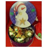 Snowman tin and Santa hat
