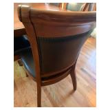 Wood dining table 78 X 48 with 8 leather and wood chairs and 24 inch leaf and table protector pads (matches lot 1001)