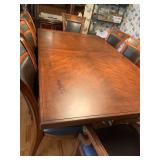 Wood dining table 78 X 48 with 8 leather and wood chairs and 24 inch leaf and table protector pads (matches lot 1001)