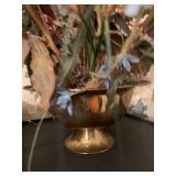 Artificial flower arrangement in brass pot