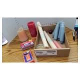 Assorted candles, tapers and matches