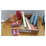 Assorted candles, tapers and matches