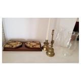 Book ends, brass candlestick, brass bell and 2 hurrican shades