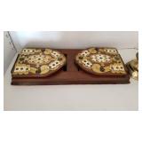 Book ends, brass candlestick, brass bell and 2 hurrican shades