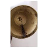 Book ends, brass candlestick, brass bell and 2 hurrican shades