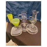 2 glass pitchers, plastic bowls and cups, random glass lids