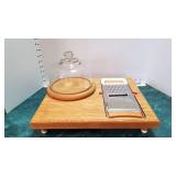 Wood cutting board with cheese slicer and wood/glass cheese holder