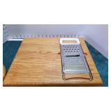 Wood cutting board with cheese slicer and wood/glass cheese holder