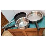 2 skillets and part of a double boiler